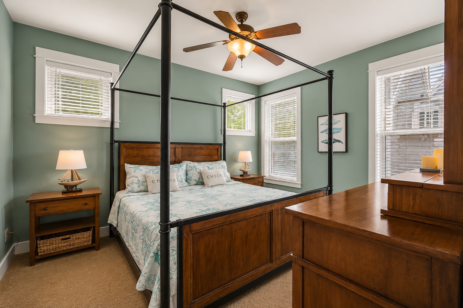 Primary bedroom with canopy king bed