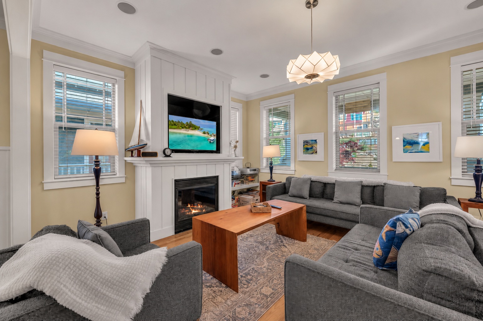 Main living room with fireplace and chandelier